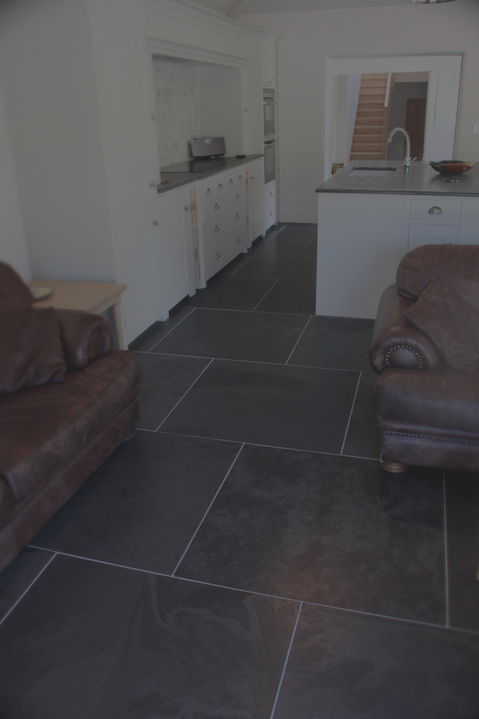 Cozy Open plan living with Black Brazilian slate flooring